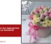 Funeral flowers arrangement in a pink floral box for a memorial service